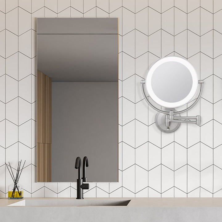 Zadro LEDW410 705004419475 environment photo front view on tiled bathroom wall, lighted wall mounted makeup mirror with magnification & extendable arm in front of a real life setting