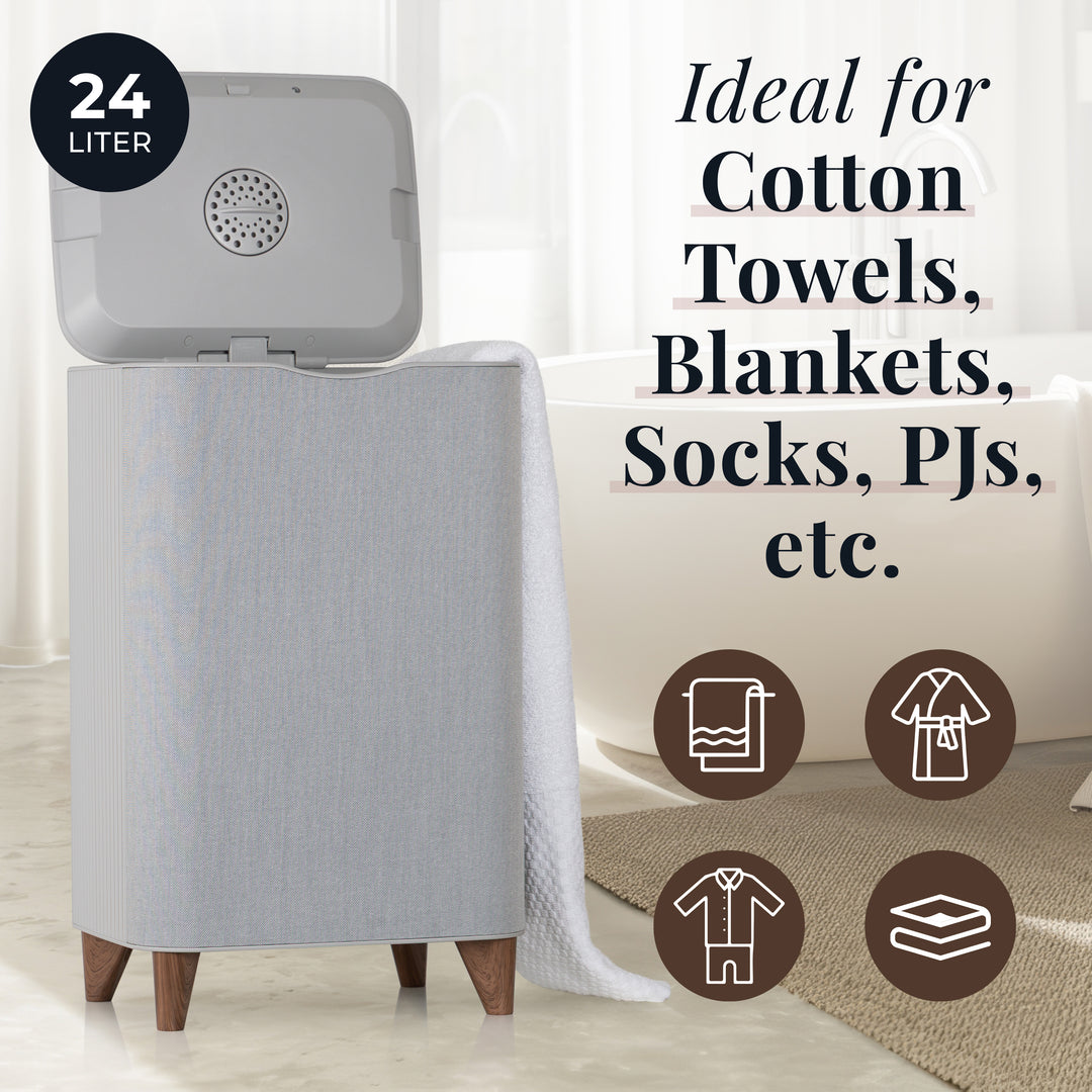 Large towel warmer machine with text indicating its use for warming laundry items, placed in a room.