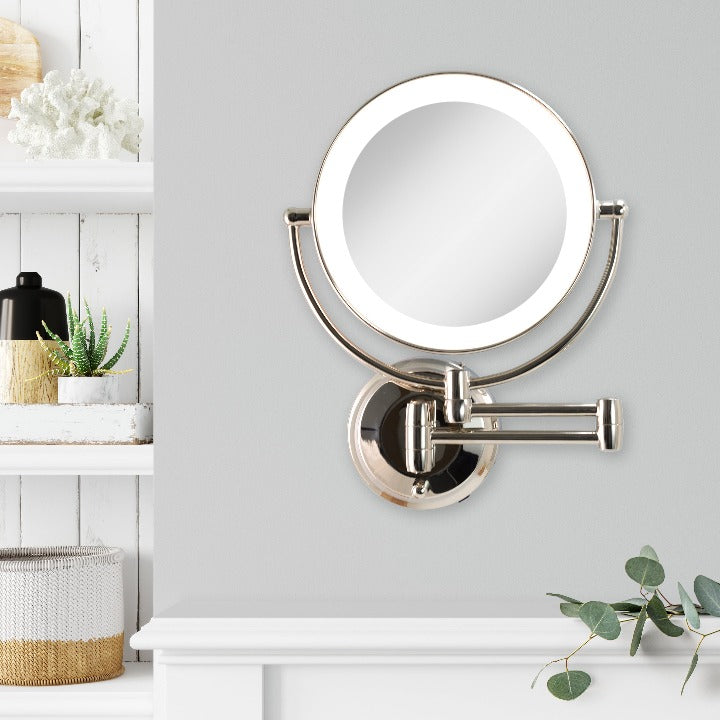 Zadro LEDW410 705004419475 environment photo front view next to storage, lighted wall mounted makeup mirror with magnification & extendable arm in front of a real life setting