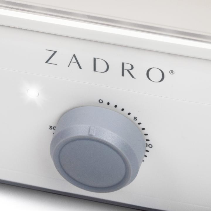 Zadro TWSWH4C 705004424592 product photo timer dial close up, towel steamer with tongs in front of a white background