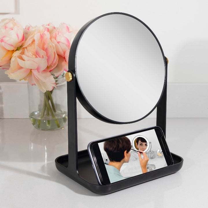 Zadro ZBVT2000 705004423410 environment photo in use holding cellphone, back-to-school makeup mirror with accessory tray & phone holder in front of a real life setting