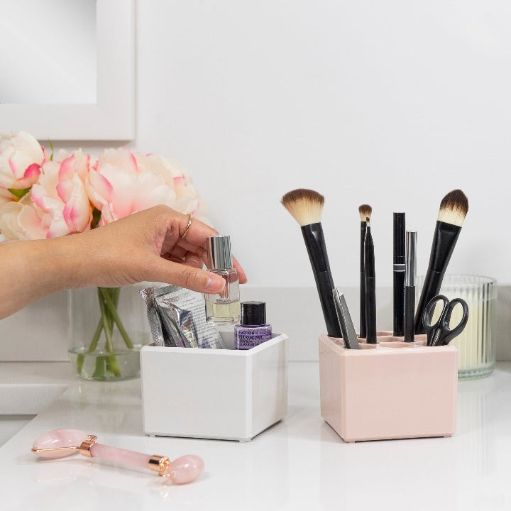 Zadro ZOR2WSR 705004423526 environment photo in use hand placing product, acrylic beauty makeup organizers - bundle cube in front of a real life setting